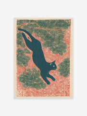 Japanese black cat art print in Ukiyo-e style, leaping through pine branches on a red textured background.
