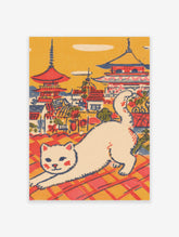 Vintage Japanese cat art print showing a white cat stretching on a red and orange tiled rooftop with pagodas in the background.