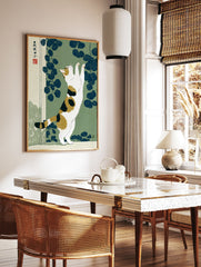 Japanese Ukiyo-e style print of a calico cat stretching against a green background with dark blue leaves. - Image 2