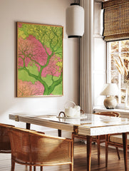 Japanese-inspired illustrative tree art print with pink blossoms and green foliage on a light green, in a styled room mockup