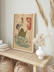 Japanese Ukiyo-e style print of a red-crowned crane on a green turtle, with blue waves and, in an alternate framed mockup