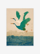 Japanese Crane Wall Art featuring two teal and white cranes flying above blue and gold swirling waves in a traditional art style.