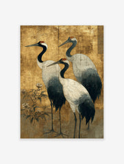 Japanese art print of three red-crowned cranes with black necks and white bodies on a textured gold background