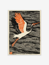 Japanese Crane Wall Art, a woodblock print of a white crane with orange wings flying over black and white ocean waves.