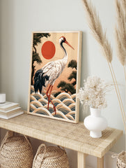 Japanese red-crowned crane illustration with stylized waves, pine trees, and a red sun, art, in an alternate framed mockup