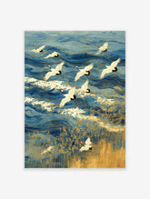 Japanese Red-crowned cranes flying over blue ocean waves with gold outlines and golden reeds