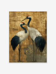 Two elegant Japanese Red-crowned Cranes with dark blue and white plumage on a textured golden background