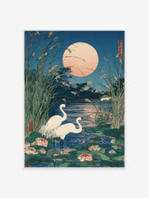 Japanese Ukiyo-e print featuring two white cranes in a lotus pond under a large pale full moon, surrounded by tall reeds.