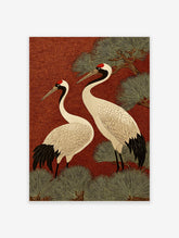 Two Japanese Red-crowned Cranes with black and white plumage, red crowns, against a red swirling pattern background with