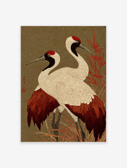 Two red-crowned Japanese cranes with white, red, and black plumage standing in red foliage against a green wave-patterned