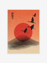 Four black cranes flying across a red sun and stylised mountain against an orange sky, with Japanese text