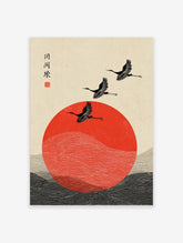 Japanese crane wall art with three black birds flying over a red sun and stylised waves