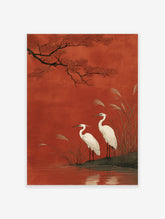 Japanese egret wall art print showing two white birds by water with red leaves and tall reeds against a rich red background.