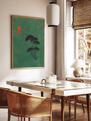 Japanese fan leaves botanical art print with dark foliage on a textured green background and a red, in a styled room mockup
