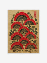 Red, black, and gold Japanese folding fan wall art with green foliage on a textured beige background