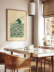 Green woodblock print of a Japanese fisherman in a conical hat, spearing fish in stylised waves, in a styled room mockup