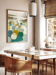 Illustrative Japanese fishing floats with netting in blue, green, and yellow on calm water with, in a styled room mockup