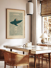 Japanese folk art print of a woman riding a spotted whale shark on wavy teal water with Kanji text, in a styled room mockup