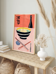 Japanese Food Poster with a black bowl of yellow noodles, black sake bottle, and coral chopsticks on a pink and coral background. - Image 4