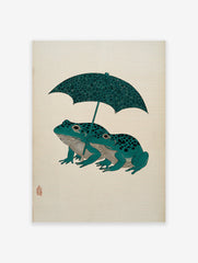 Japanese woodblock style art print of two teal frogs with black spots under a patterned dark green umbrella on a cream background.