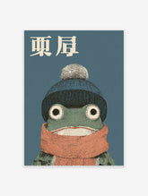 Japanese frog art print featuring a green frog wearing a blue knit hat with a pompom and an orange scarf on a blue background.