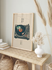 Japanese illustrative print of a green frog on a turntable with a vinyl record, featuring, in an alternate framed mockup