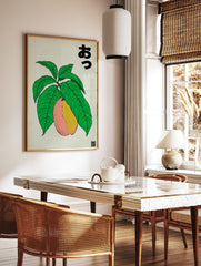 Japanese fruit poster featuring a pink and yellow peach or mango on a green leafy branch with Japanese text. - Image 2