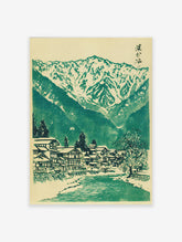 Japanese landscape woodblock print featuring a snowy mountain village, river, and green trees on a cream background.
