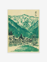 Japanese landscape woodblock print featuring a snowy mountain village, river, and green trees on a cream background.