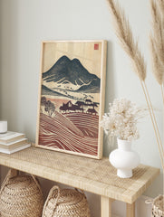 Japanese woodblock style landscape print with dark mountain, village houses, and, in an alternate framed mockup