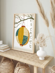 Japanese lantern wall art print with paper chōchin hanging from a berry branch and, in an alternate framed mockup
