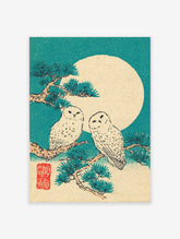 Japanese owl wall art print featuring two snowy owls on a pine branch with a large full moon in a teal sky.