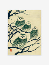 Japanese owl print featuring four green and white owls perched on dark blue branches on a cream textured background, with red seal.