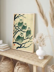 Japanese owl print featuring four green and white owls perched on dark blue branches on a cream textured background, with red seal. - Image 3