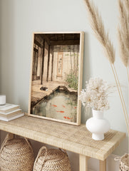 Japanese Pond Poster featuring a sleeping grey cat next to a koi fish pond with bamboo plants and traditional architecture. - Image 4