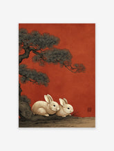 Japanese style illustration of two white rabbits under a pine tree on a red background with an artist's seal.