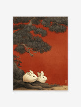 Japanese Rabbit Wall Art print featuring two white rabbits under a large pine tree against a vibrant red, textured background.