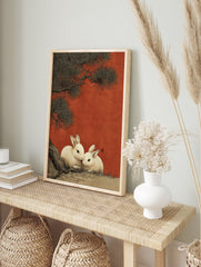 Japanese rabbit art print showing two white rabbits under a dark pine tree against a textured red background, in an illustrative style. - Image 3