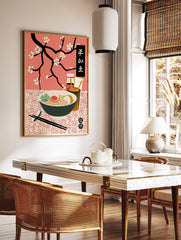 Japanese ramen poster with a bowl of noodles, egg, and greens, chopsticks, condiments, and black cherry blossom branches on a pink background. - Image 2