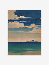 Japanese seascape wall art featuring a deep blue sky with white clouds, distant mountains, and calm blue-green ocean.