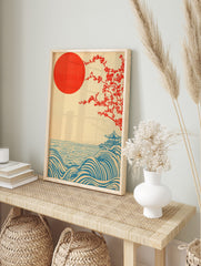 Japanese landscape print with red sun, flowering tree, blue waves, and a pagoda on a hill, in an alternate framed mockup