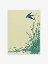 Japanese swallow art print featuring a blue bird flying over green reeds against a light yellow background.