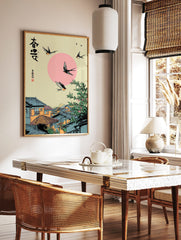 Japanese swallows flying over a traditional village with a pink sun and green tree, featuring, in a styled room mockup