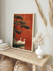 Japanese Swan Wall Art print showing two white swans by a lake with a large pine tree against a red background. - Image 3