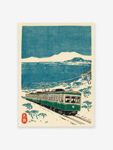 Japanese Train Wall Art woodblock print featuring a green train on tracks by a snowy blue sea and distant mountains.