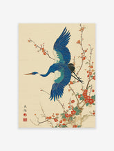 Japanese Wall Art print of a blue crane bird flying among red plum blossoms on a textured cream background.