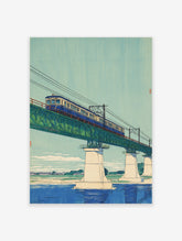 Japanese wall art print of a blue train on a green truss bridge over a river, with a light blue sky and distant landscape.