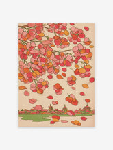Traditional Japanese wall art featuring pink and orange cherry blossoms falling over a village with temples and a river.