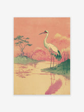 Vintage Japanese wall art print of a white crane bird standing by water with a green tree and pink sky.