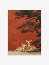 Japanese wall art print featuring two spotted deer resting under a dark pine tree against a vibrant red-orange background.